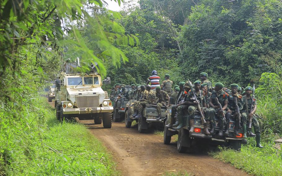 Congolese Defense Forces soldiers and United Nation forces patrol the area of an attack near the town of Oicha, 20 miles from Beni, Democratic Republic of Congo, Friday July 23, 2021.