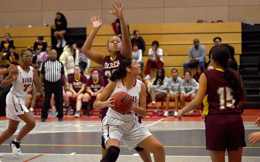 Kaiserslautern's Emma Arambula backs down Vilseck's Nyley Benson during a Dec. 2, 2023, game at Kaiserslautern High School in Kaiserslautern, Germany