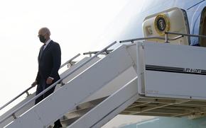 President Joe Biden exits Air Force One as he arrives at Osan Air Base, Friday, May 20, 2022, in Pyeongtaek, South Korea. (AP Photo/Evan Vucci)