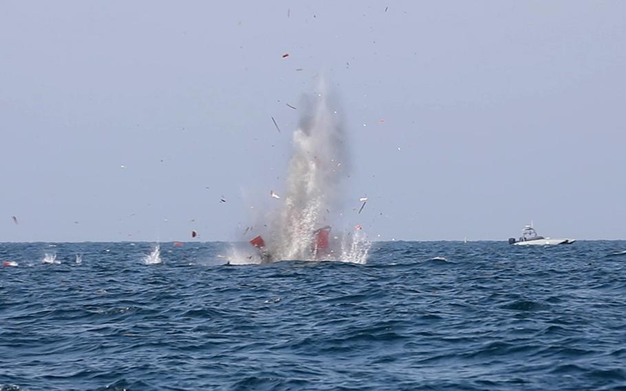 Munitions launched from a missile system aboard a T-38 Devil Ray drone boat destroy a target during exercise Digital Talon 2 in the Persian Gulf on Nov. 27, 2023.