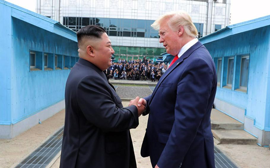 President Donald Trump speaks with North Korean leader Kim Jong Un on North Korea's side of the Joint Security Area on June 30, 2019, in this photo from the Korean Central News Agency. 