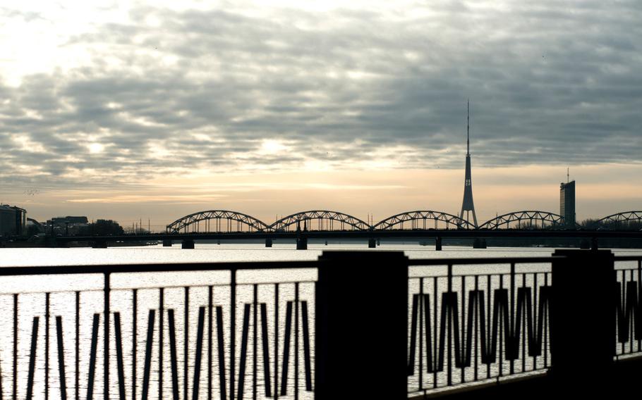 The Riga radio and television tower stands on the skyline beyond the River Daugava in Riga, Latvia, on Feb. 28, 2019. 