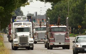 Trucks rolling down the road.