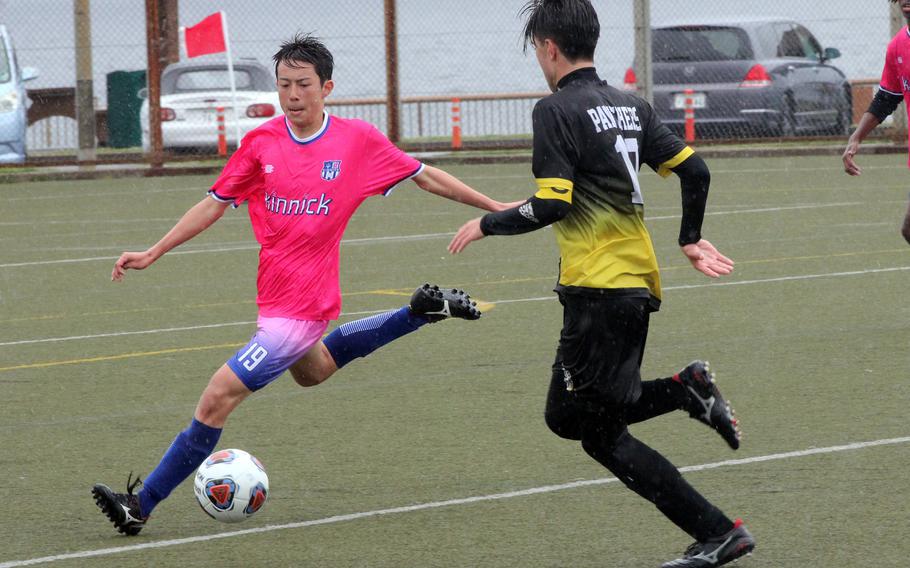 Nile C. Kinnick's Luis Galloway dribbles against Kadena's Tyler Smith.