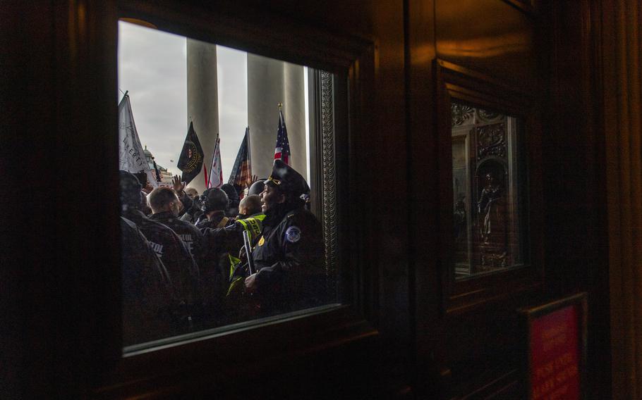 Protesters attempt to gain access to the U.S. Capitol during a joint congressional session to certify the electoral college vote in Washington on Jan. 6, 2021. 