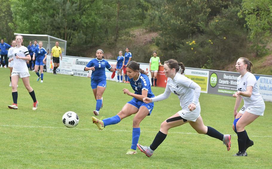 Ramstein's Isabel Fisher shoots before Lakenheath's Alyssa Salina can get to her Wednesday, May 17, 2023, in the semifinals of the DODEA-Europe Division I girls soccer championships. The shot hit the crossbar and bounced away.