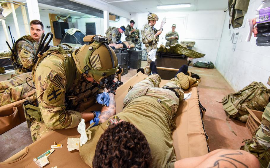 Army Sgt. Joshua Corday, a medic with the National Guard’s 54th Security Force Assistance Brigade, treats a simulated wounded soldier during a pre-deployment training exercise Aug. 23, 2023, at Muscatatuck Training Center in Indiana. Corday’s SFAB team will deploy to the Middle East in the fall alongside active-duty advisors from 3rd Security Force Assistance Brigade, which is stationed at Fort Cavazos, Texas. 