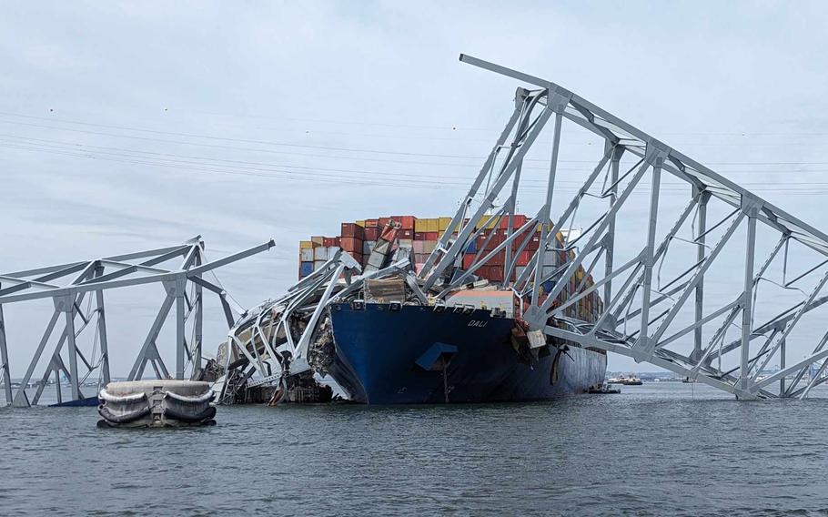 U.S. Army Corps of Engineers staff onboard Hydrographic Survey Vessel Catlett observe the damage resulting from the collapse of the Francis Scott Key Bridge in Baltimore, Tuesday, March 26, 2024.
