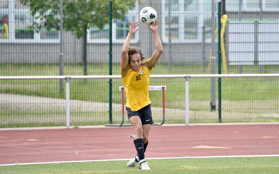 Stuttgart attacker Ryan Stevenson throws in the ball during a Division I semifinal of the DODEA European soccer championships against Ramstein on May 22, 2024, at Kaiserslautern High School in Kaiserslautern, Germany.