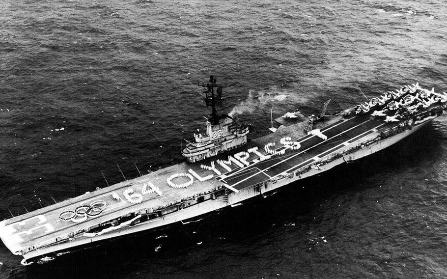 In the Oct. 17, 1964, edition reporting the overthrow of Soviet leader Nikita Khrushchev, Stars and Stripes ran this aerial photograph of the USS Kearsarge cruising in the South China Sea while its crew paraded on deck forming the Olympic rings and the message “64 OLYMPICS.”