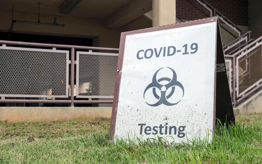 A sign points people to a COVID-19 testing site at Osan Air Base, South Korea, Sept. 1, 2020. 