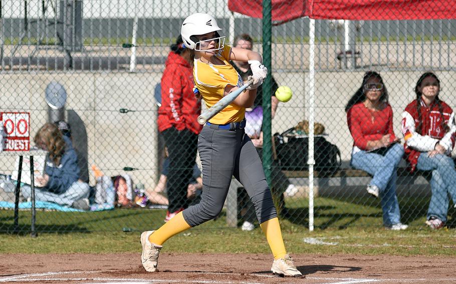 Paige Welch hits the ball.
