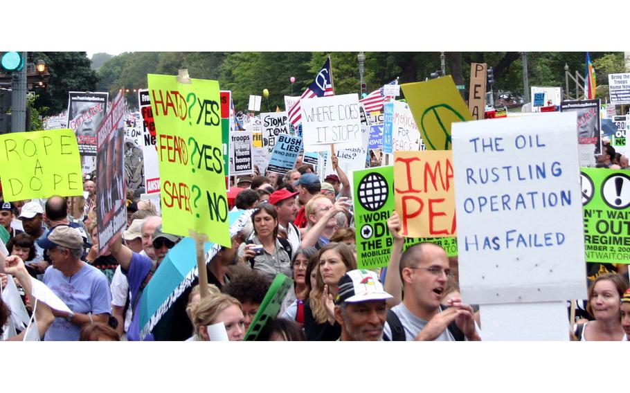 Thousands of protesters march up 15th Street in Washington, D.C., on their way to the White House, Sept. 24, 2005