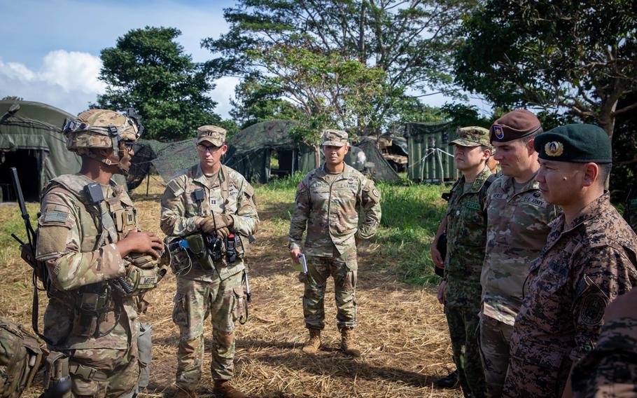 Distinguished visitors and senior officials from Bangladesh, Japan, South Korea and Mongolia take part in Joint Pacific Multinational Readiness Center (JPMRC) 23-01 at the South Range training site at Schofield Barracks, Hawaii, Nov. 4, 2022. 