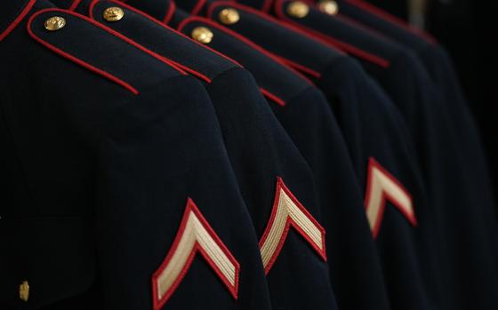 U.S. Marine Corps dress blue uniforms hang on a rack during the first uniform fitting at Marine Corps Recruit Depot San Diego, March 21, 2023. Recruits were fitted several times throughout recruit training to ensure their uniforms were ready to be worn as Marines. 