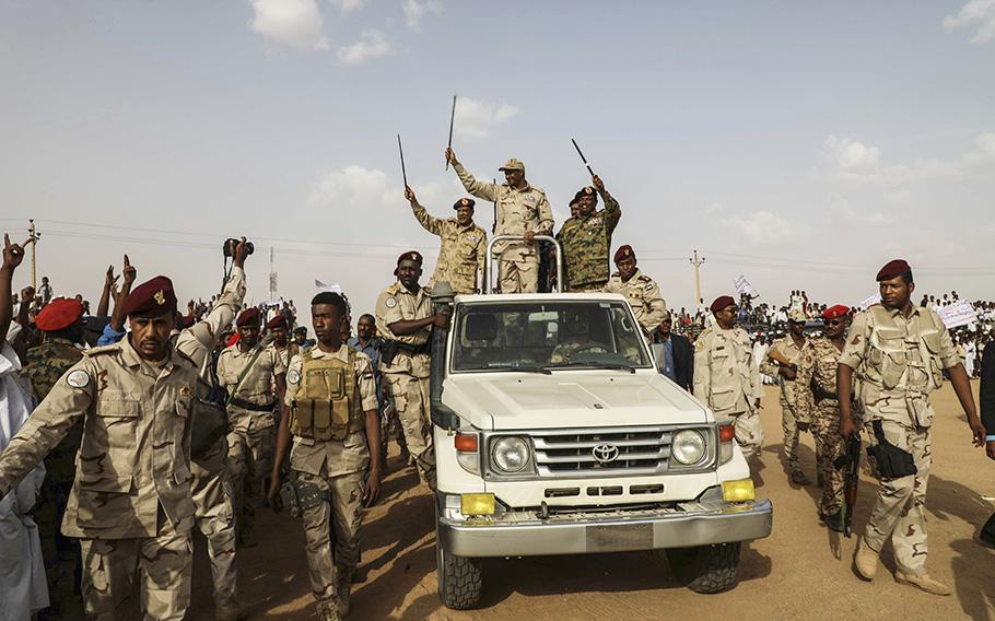 Gen. Mohammed Hamdan Dagalo, the deputy head of the military council, waves to a crowd during a military-backed tribe’s rally, in the Nile River state, Sudan, on July 13, 2019. 