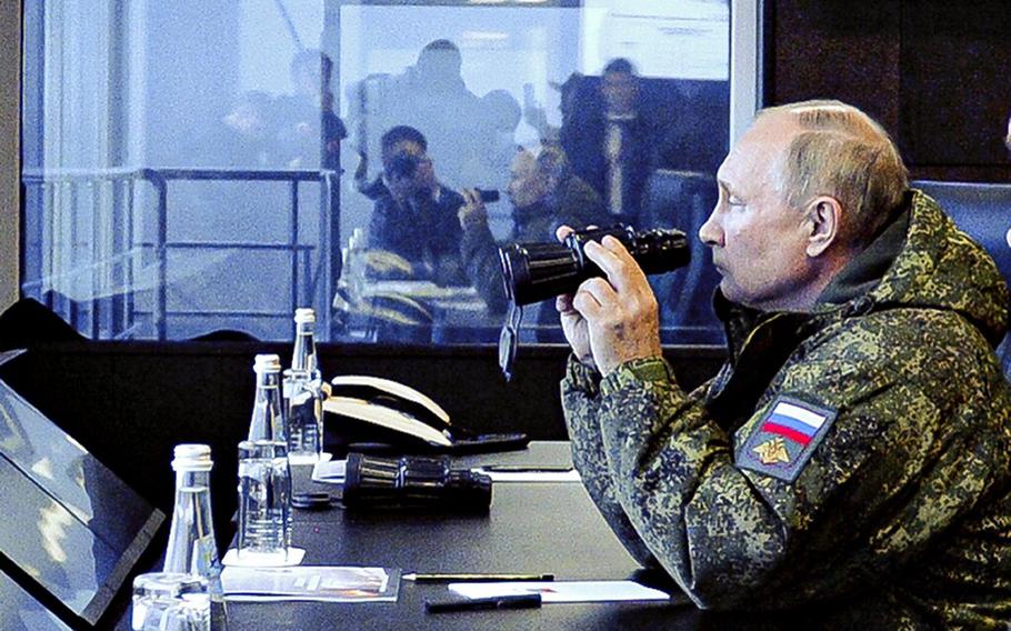 Russian President Vladimir Putin watches the Vostok 2022 military exercise in far eastern Russia, outside Vladivostok, on Tuesday, Sept. 6, 2022. 