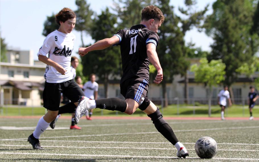 Osan's Reid Iverson gets set to boot the ball against Zama's Earl Rice.