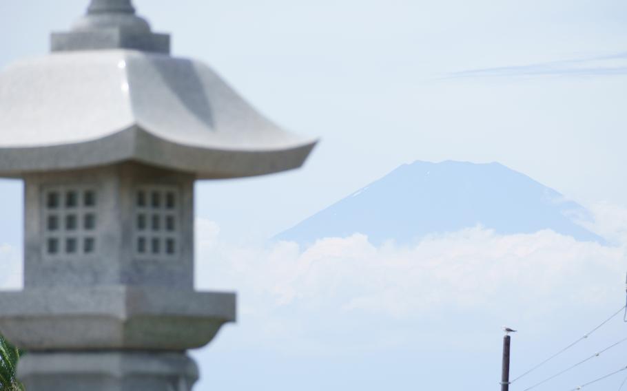Mount Fuji's summit is seen from Enoshima Beach in Fujisawa city, Japan, Aug. 2, 2021. 