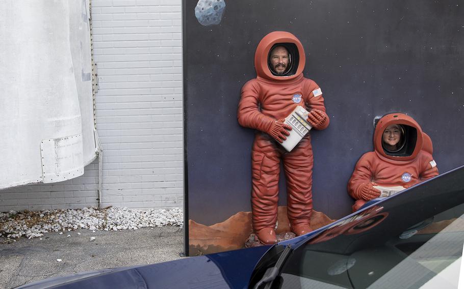 Robert Streicho, 42, and Mary Kathleen Bryan, 45, of Nashville, pose for a picture outside of the American Space Museum in Titusville.