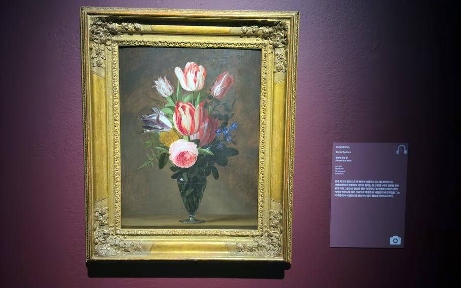 A painting of a vase of flowers.