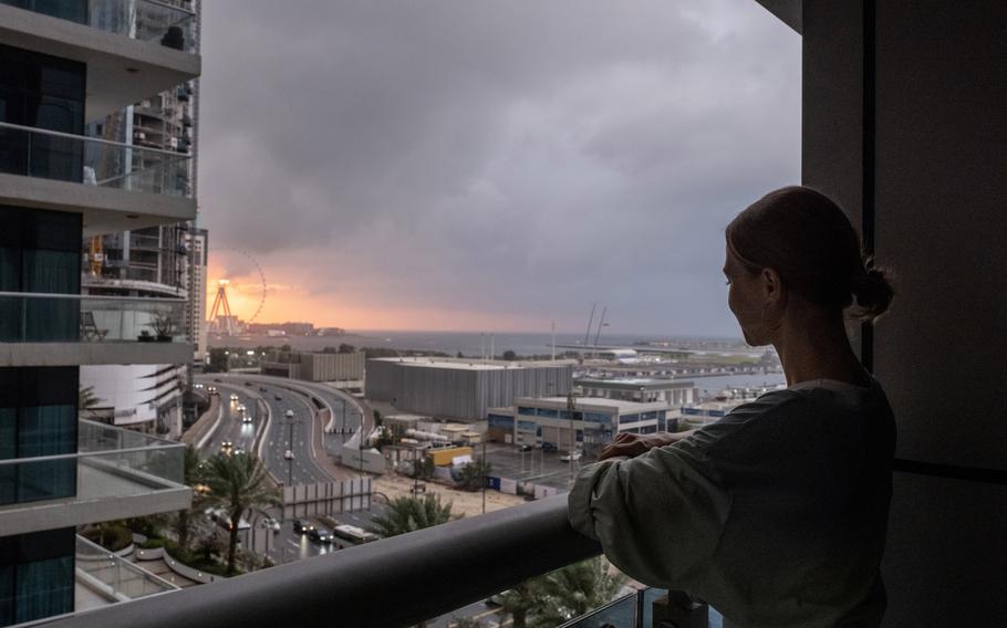 Anastasia Smernova, a Russian fitness trainer and influencer, on her balcony in a co-living space occupied mainly by middle-class Russians who relocated to Dubai, on Jan. 27.