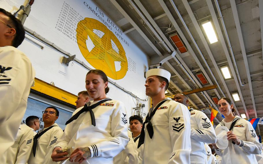 Sailors aboard the USS Bataan amphibious assault ship on May 5, 2024, as the ship pulls into the Miami port for Fleet Week.