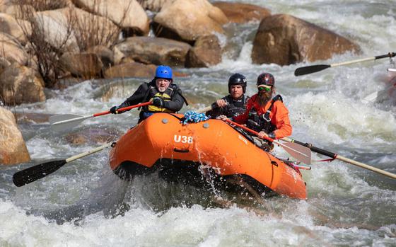 Los Angeles Times reporter Jack Dolan, left, negotiates The Wall during a whitewater tour with Evan Moore, general manager of Sierra South Mountain Sports, and guide Zach Wilfey on the upper Kern River on April 6, in Kernville, Calif. The winter and early spring storms have brought plenty of water which is good news for the local businesses. 