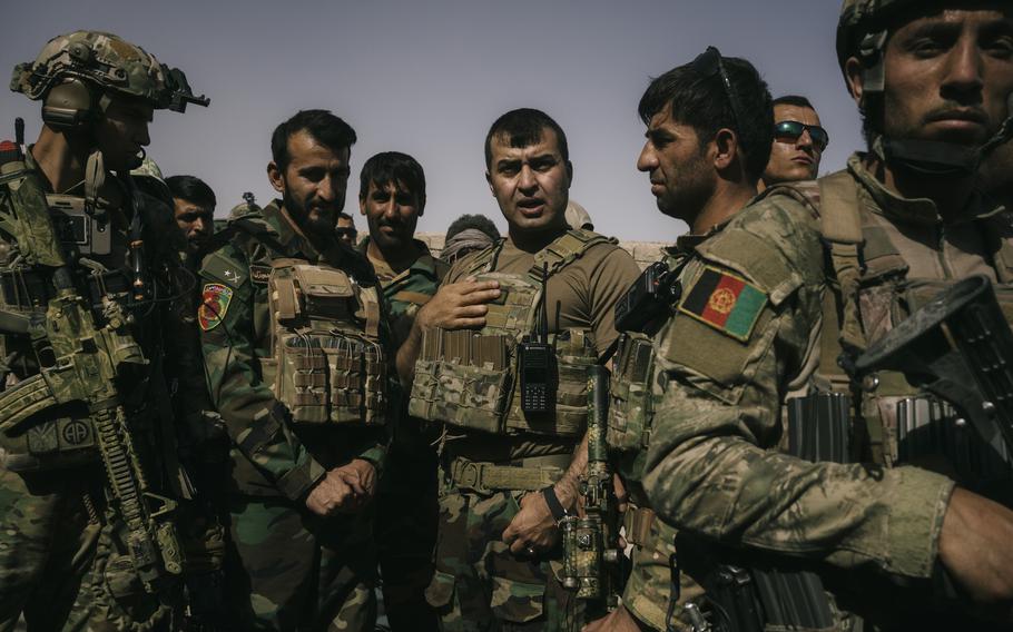 Gen. Sami Sadat talks with troops during a May 25 visit at Nazar outpost near Lashkar Gah. 