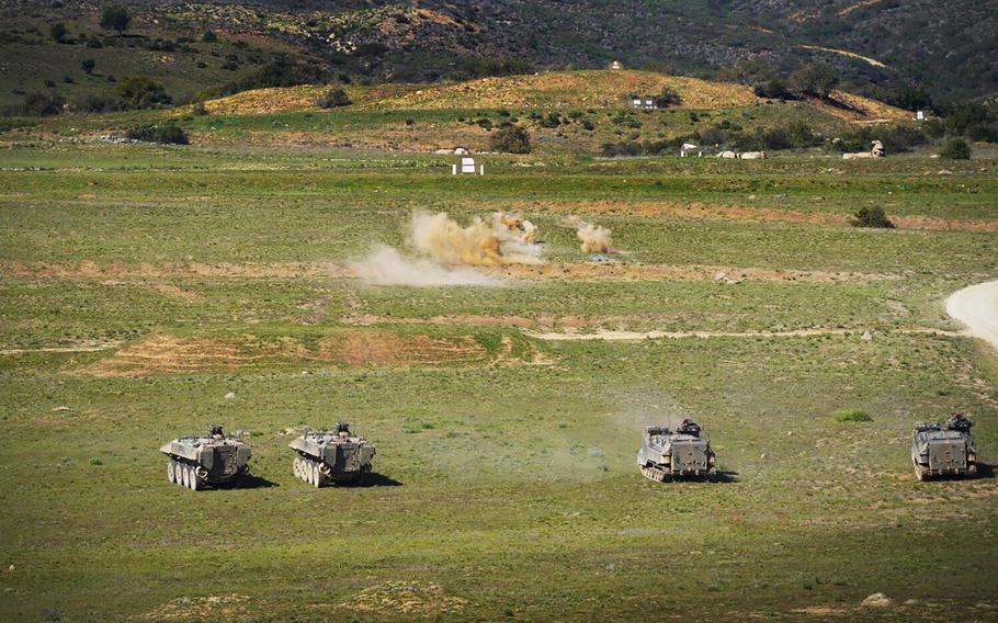 At Camp Pendleton on Wednesday, Feb. 9, 2022, in Oceanside, California, as Marines maneuver their Amphibious Combat Vehicles (ACV), two at left, alongside Japan's Ground Self-Defense Force (JGSDF) Amphibious Assault Vehicle (AAV), two at right, take part in exercise Iron Fist 2022. 