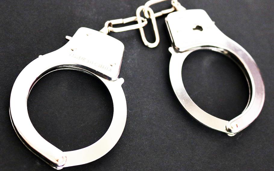A U.S. military spouse on Okinawa was arrested this week on suspicion of entering the home of her husband's alleged lover and threatening her with a knife.