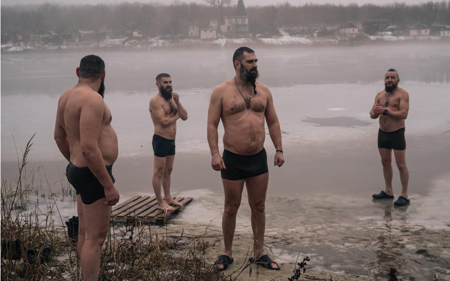 Soldiers fighting in Kupyansk celebrate the Feast of the Epiphany last week with a swim in a frozen lake.