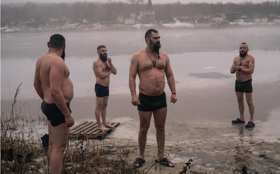 Soldiers fighting in Kupyansk celebrate the Feast of the Epiphany last week with a swim in a frozen lake.