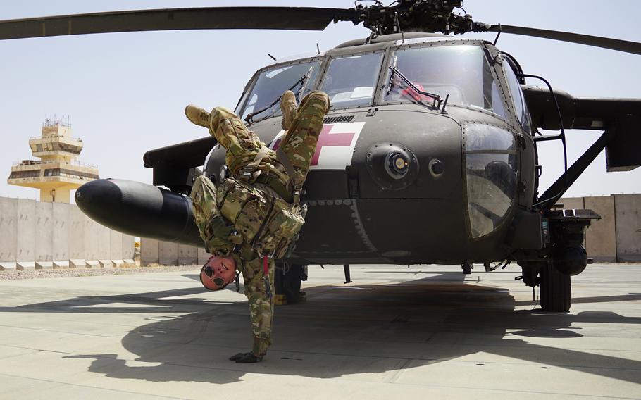 Staff Sgt. Brianna Pritchard, an Army National Guard UH-60 Black Hawk helicopter mechanic from Anchorage, Alaska, demonstrates her breaking moves at al Asad Air Base, Iraq. 