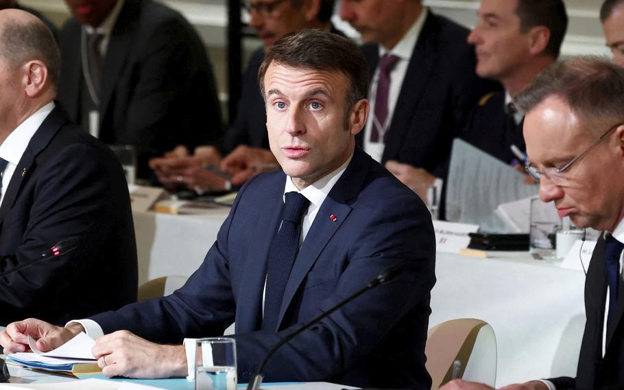French President Emmanuel Macron (centre-right) speaks at the Elysée Palace in Paris on Monday, February 26, 2024.