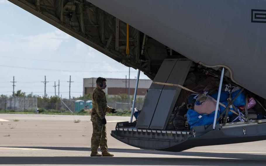 An Airman assigned to Task Force-Holloman prepares to unload luggage in support of Operation Allies Welcome, Aug. 31, 2021, on Holloman Air Force Base, N.M. The Department of Defense, through U.S. Northern Command, and in support of the Department of Homeland Security, is providing transportation, temporary housing, medical screening, and general support for up to 50,000 Afghan evacuees at suitable facilities, in permanent or temporary structures, as quickly as possible.