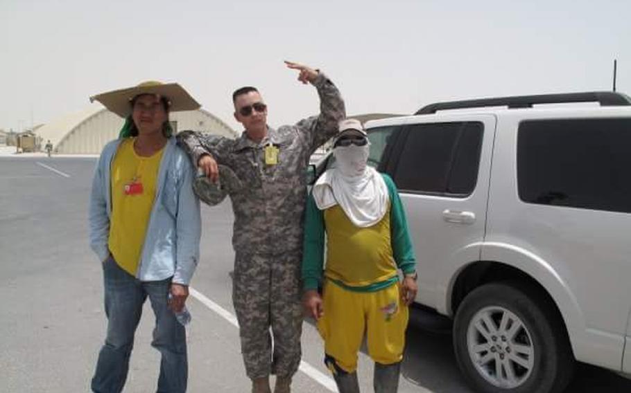 U.S. soldier Lincoln Crisler stands with friends while deployed to Qatar in 2009.