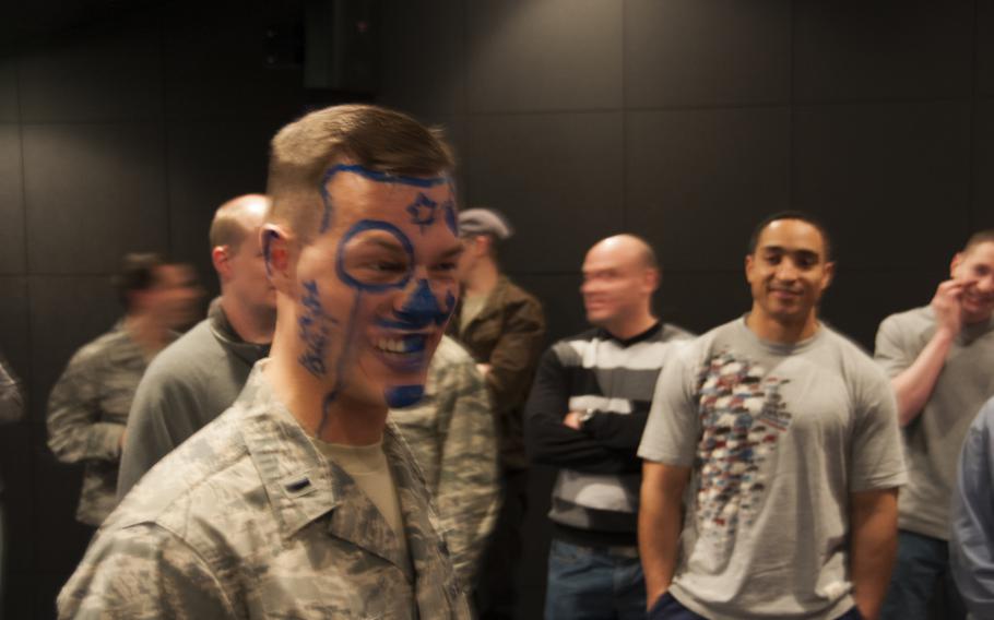First Lt. Matthew Smokovitz at his “blue nose” party the night before leaving Thule. Those stationed at the base become members of the “Royal Order of the Blue Nose.” With so many well-wishers, Smokovitz wound up with a bit more blue.