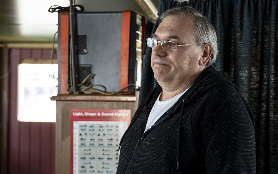 Vitaliy Boyko, 53, talks in the bridge of the ship "Ocean Force," at the Philaport in Philadelphia on March 15. Boyko is among a crew of seven who have been aboard the ship since July. 