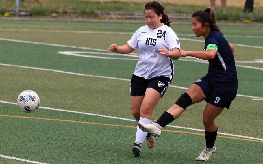 Osan's Clarice Lee boots the ball past Korea International's Jangee Portillo during Saturday's Korea girls soccer match. The Phoenix won 6-2.