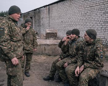 Azov recruits smoke one of three cigarettes they are allotted per day. 
