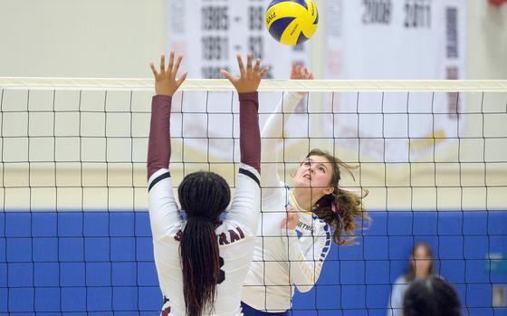 Yokota's Lilly Wellons spikes against Matthew C. Perry's Aisha Nuridin-Watley during Friday's DODEA-Japan volleyball match. The Panthers won in four sets.