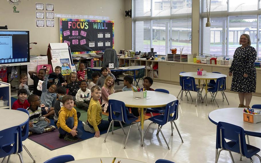 Teacher Callie Jackson and her first-graders pose in their classroom at Shirley Lanham Elementary School at Naval Air Facility Atsugi, Japan, Wednesday, Oct. 19, 2022. 