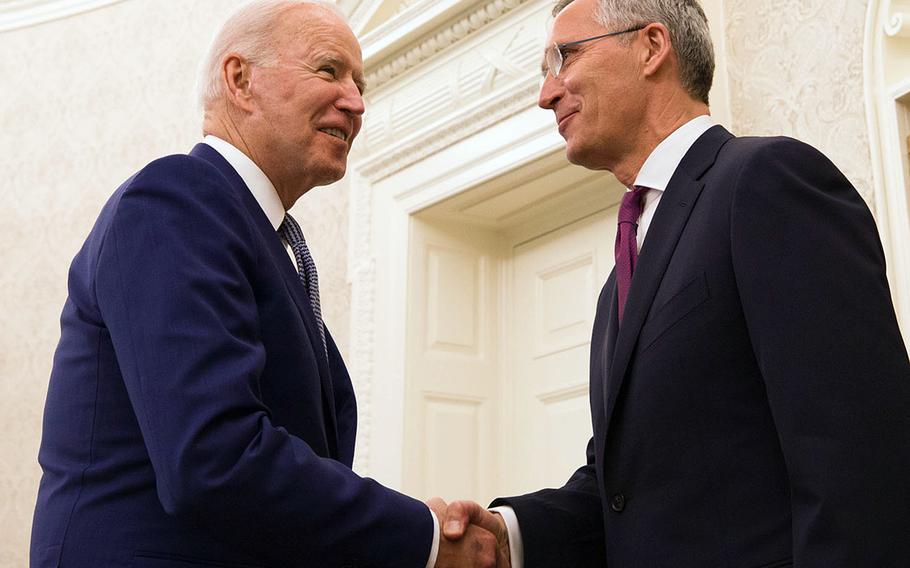 NATO Secretary-General Jens Stoltenberg shakes hands with U.S. President Joe Biden at a meeting in Washington, June 7, 2021. The president will participate in a NATO summit in Brussels on June 14.
