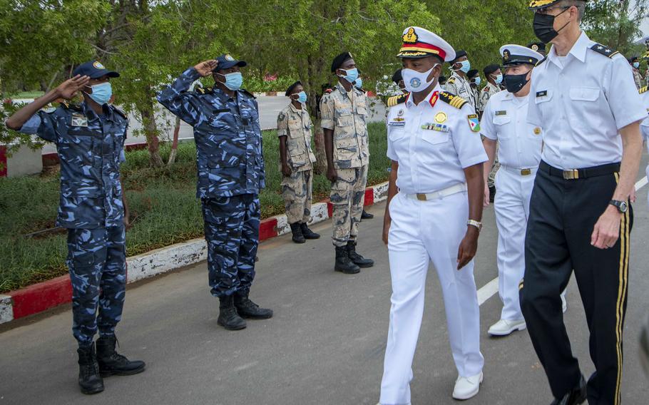 Col. Ahmed Daher Djama, of the Djiboutian navy, walks with Maj. Gen. William Zana, right, Combined Joint Task Force-Horn of Africa commander, July 25, 2021, following the opening ceremony of exercise Cutlass Express 2021 in Djibouti. 