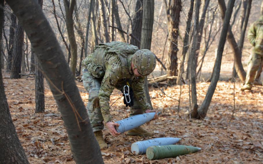 Army Staff Sgt. Mark Gersper removes simulated unexploded ordnance during the Korea EDO Team of the Year competition at Camp Humphreys, South Korea, Jan. 11, 2023. He serves as a team leader for 718th Ordnance Company (EOD), 23rd Chemical, Biological, Radiological and Nuclear Battalion.