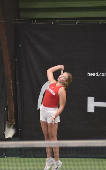 Kaiserslautern’s Stella Schmitz serves during her match with Ansbach’s Meredith Maxwell on Thursday during the DODEA European tennis championships at the T2 Sports Health Club in Wiesbaden, Germany. 