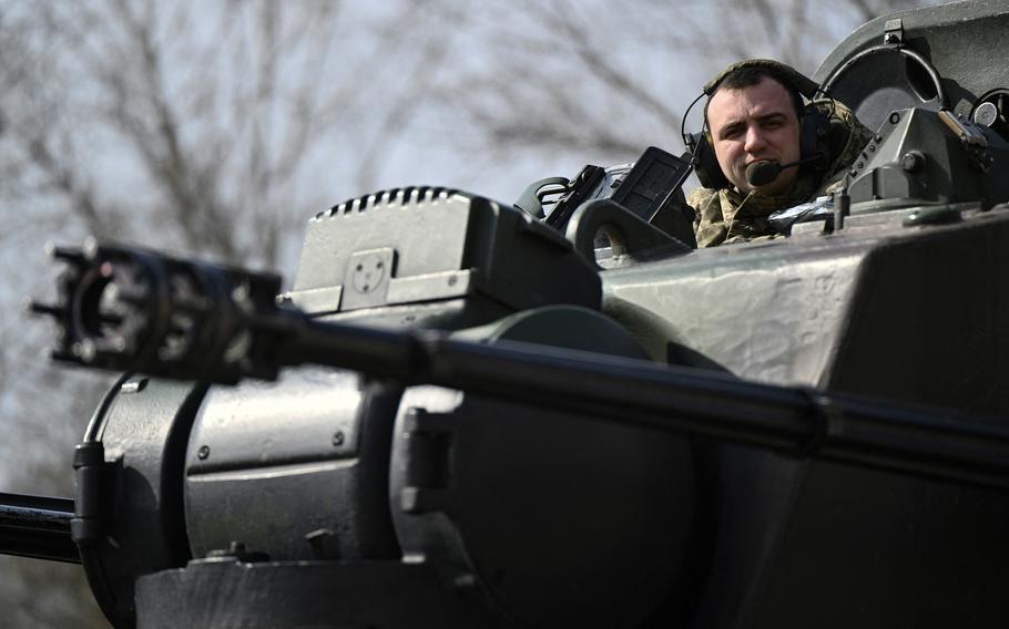 A Ukrainian service member, part of the crew for a German-made self-propelled anti-aircraft (SPAAG), better known as the Flakpanzer Gepard, prepares for a combat duty in Kyiv region, on March 21, 2024, amid the Russian invasion of Ukraine. 