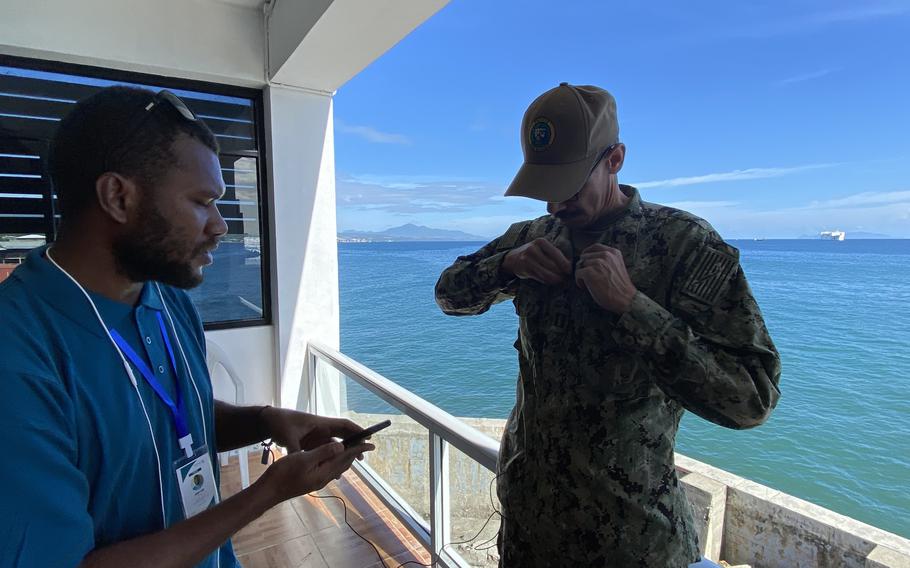 Navy Lt. Steven Szelmeczki, a chaplain assigned to Pacific Partnership 2022, conducts a press conference with local media as USNS Mercy pulls into Honiara, Solomon Islands, Aug. 29, 2022.  