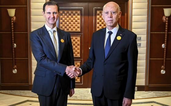 In this photo provided by the Tunisian Presidency, Tunisian President Kais Saied, right, shakes hand with Syrian President Bashar Assad, in Jeddah, Saudi Arabia, during the Arab summit, Friday, May 19, 2023. (Slim Abid/Tunisian Presidency via AP)